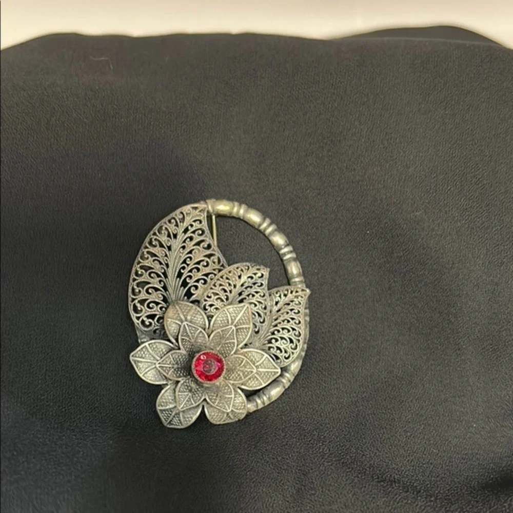 Elegant Silver Floral Brooch with Red Accent